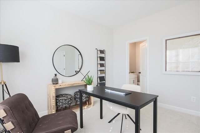 carpeted office with baseboards