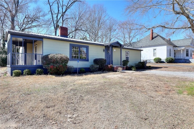 single story home with covered porch