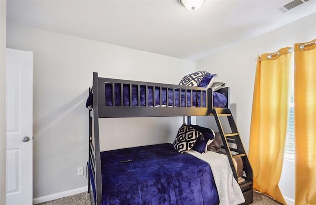 bedroom with baseboards, visible vents, and carpet floors