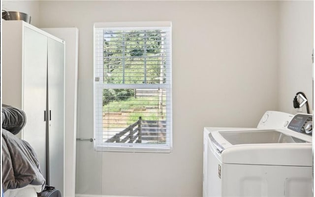 laundry room featuring independent washer and dryer and laundry area