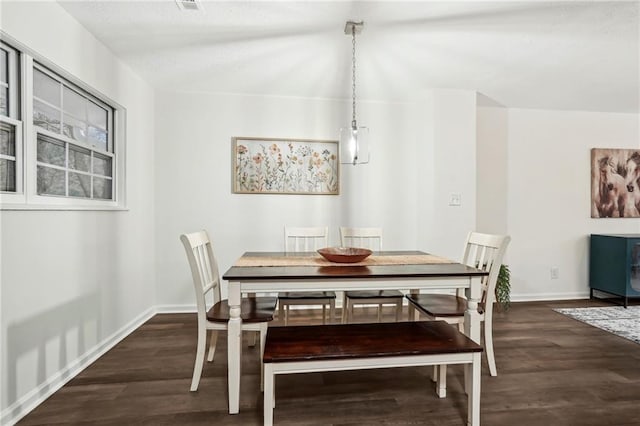 dining space with dark wood-style floors and baseboards