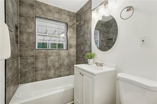 full bathroom featuring bathtub / shower combination, vanity, and toilet