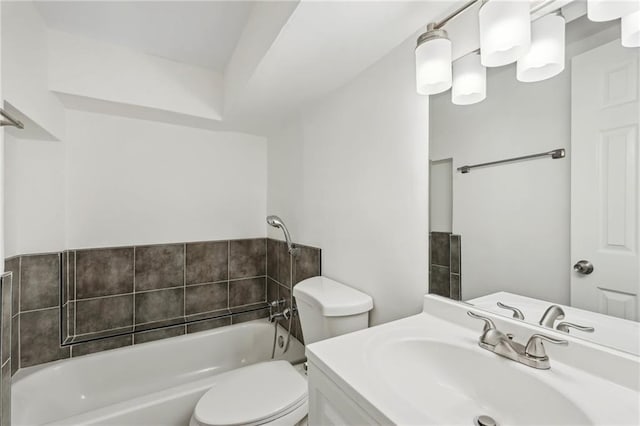 full bath with a tub to relax in, vanity, and toilet