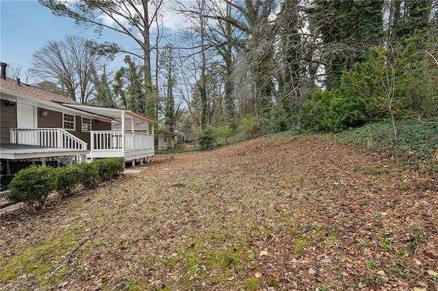 view of yard featuring a deck