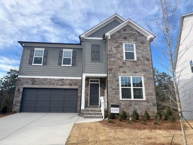 craftsman house with board and batten siding, concrete driveway, and an attached garage