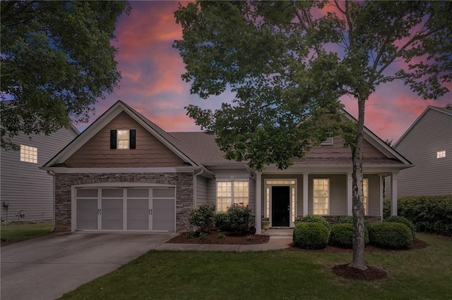 view of front of house with a lawn and a garage