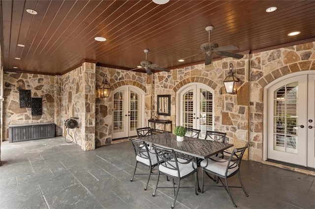 view of patio / terrace featuring french doors, outdoor dining area, and a ceiling fan