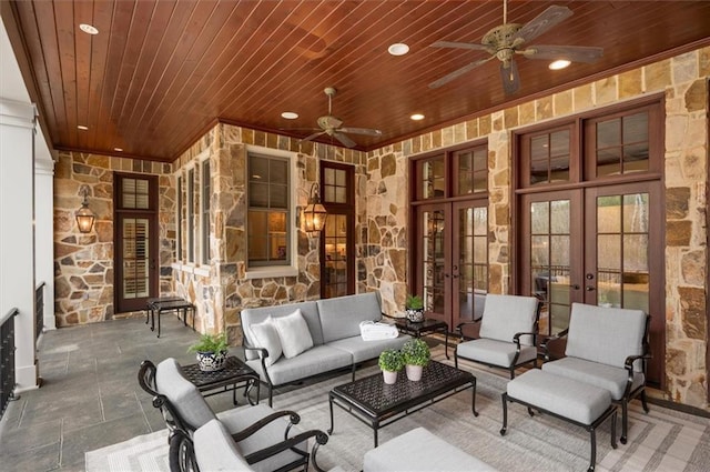 view of patio / terrace featuring french doors, a ceiling fan, and an outdoor living space