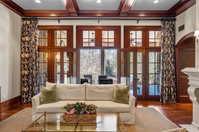 living room with french doors, wood finished floors, crown molding, beamed ceiling, and recessed lighting