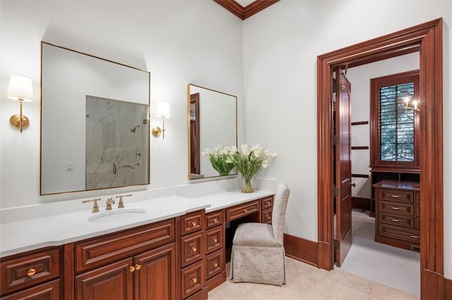 bathroom with a marble finish shower and vanity