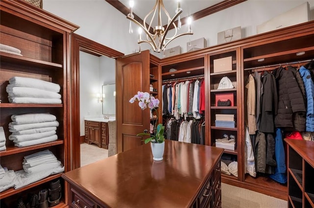 walk in closet featuring a chandelier and light carpet