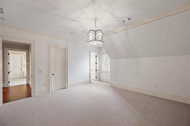 additional living space with a chandelier, carpet, baseboards, and lofted ceiling