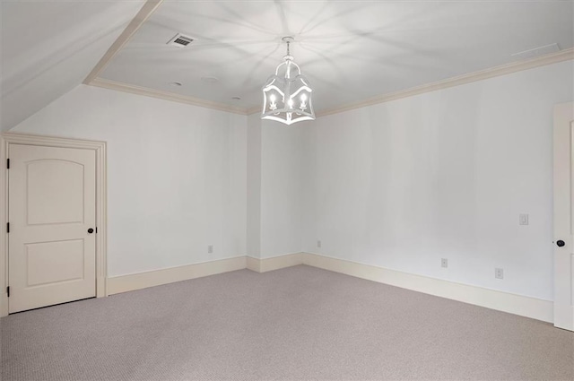 carpeted empty room featuring a chandelier, crown molding, and baseboards