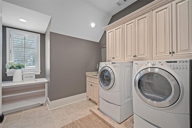 laundry area featuring independent washer and dryer, cabinet space, baseboards, and recessed lighting