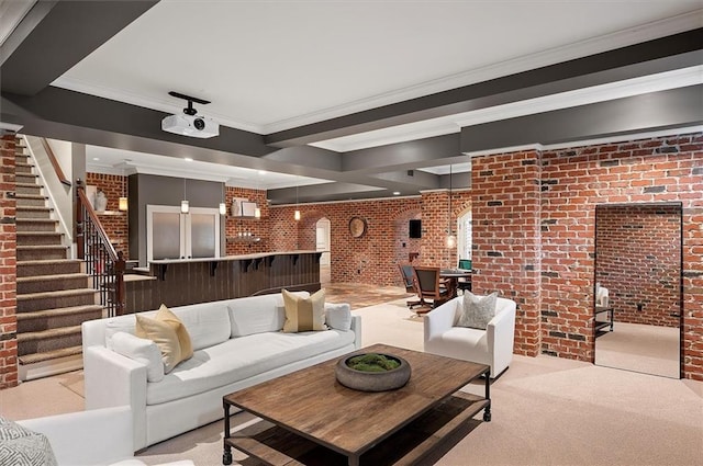 living room featuring brick wall, stairway, carpet floors, and ornamental molding