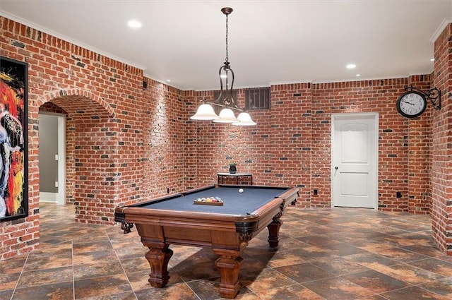 playroom featuring brick wall, recessed lighting, stone finish floors, billiards table, and ornamental molding