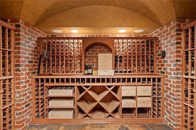 wine room featuring brick wall
