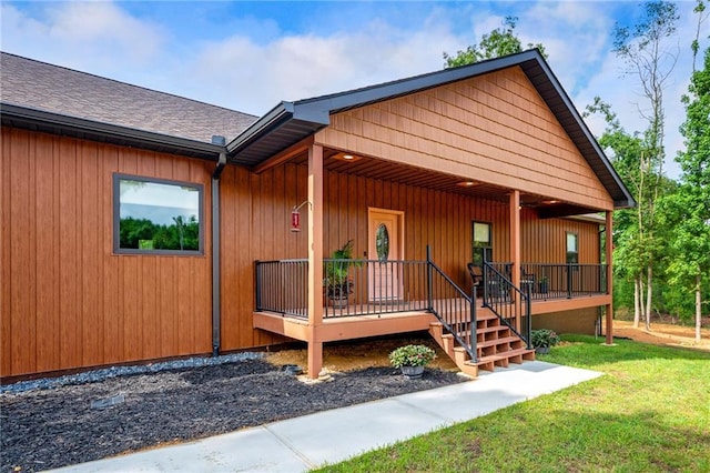 exterior space with a front lawn and covered porch