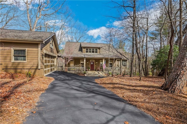 view of front of house with a garage and a porch