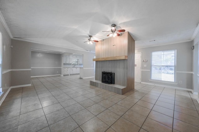 2173 Martin Way, Jonesboro, GA 30236 - unfurnished living room featuring tile patterned floors, a ceiling fan, lofted ceiling, baseboards, and ornamental molding