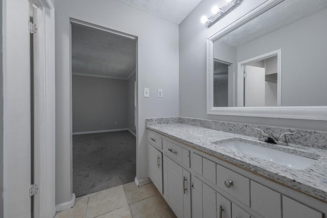 2173 Martin Way, Jonesboro, GA 30236 - bathroom with vanity, baseboards, tile patterned flooring, and a textured ceiling