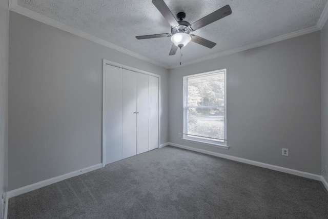 2173 Martin Way, Jonesboro, GA 30236 - unfurnished bedroom featuring carpet floors, a closet, baseboards, a textured ceiling, and crown molding