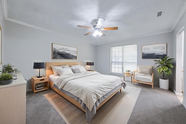 2173 Martin Way, Jonesboro, GA 30236 - carpeted bedroom featuring ornamental molding, ceiling fan, and a textured ceiling