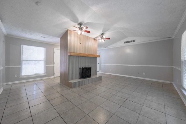 2173 Martin Way, Jonesboro, GA 30236 - unfurnished living room featuring tile patterned floors, a wood stove, vaulted ceiling, a textured ceiling, and ceiling fan
