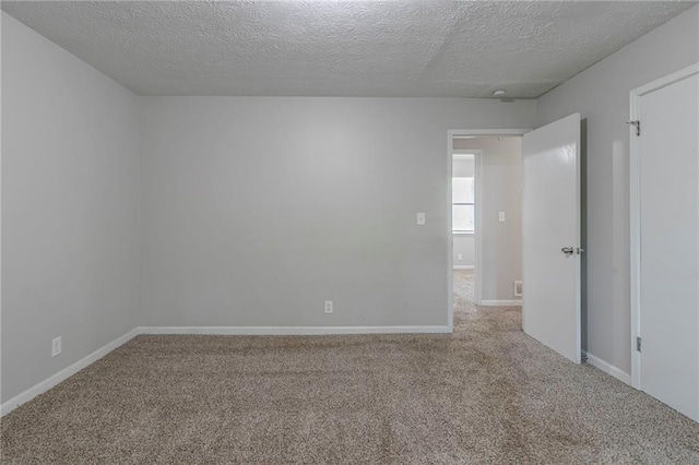 4342 Lincolndale Dr, Ellenwood, GA 30294 - unfurnished room with carpet flooring, a textured ceiling, and baseboards