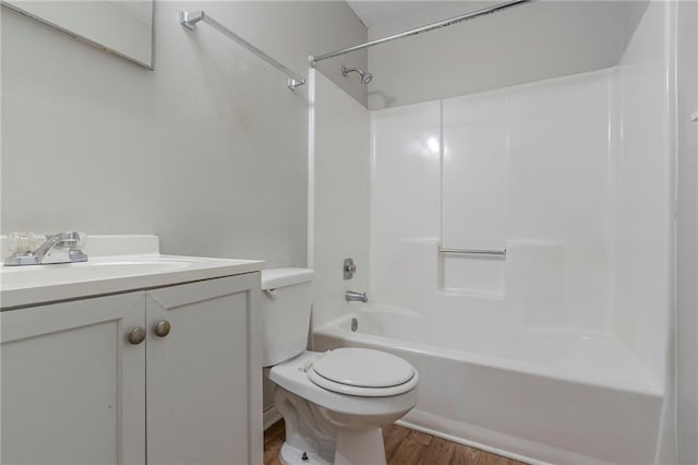 4342 Lincolndale Dr, Ellenwood, GA 30294 - bathroom featuring wood finished floors, toilet, vanity, and shower / bathtub combination