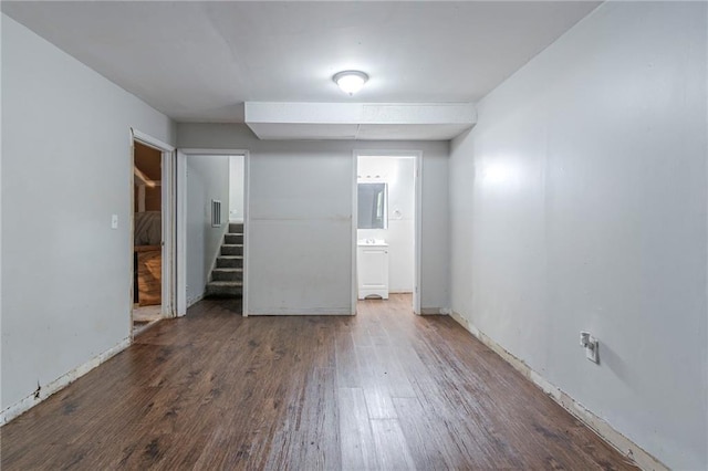 4342 Lincolndale Dr, Ellenwood, GA 30294 - unfurnished bedroom with wood finished floors, ensuite bathroom, and baseboards