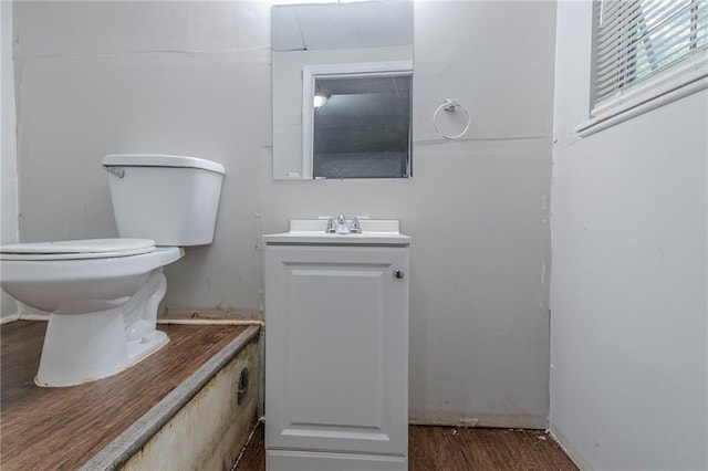 4342 Lincolndale Dr, Ellenwood, GA 30294 - bathroom featuring vanity, toilet, and wood finished floors