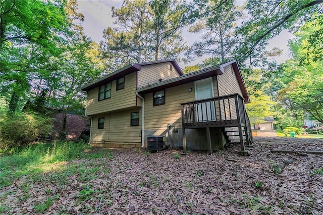 4342 Lincolndale Dr, Ellenwood, GA 30294 - rear view of house with central AC unit and a wooden deck