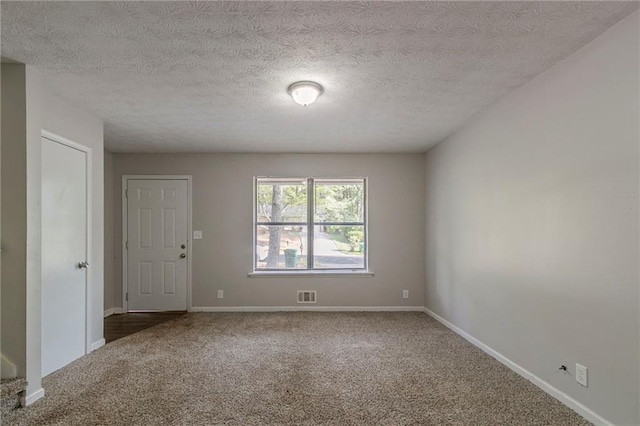 4342 Lincolndale Dr, Ellenwood, GA 30294 - carpeted empty room with baseboards and a textured ceiling