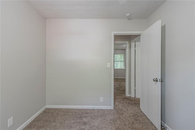 4342 Lincolndale Dr, Ellenwood, GA 30294 - empty room with carpet, baseboards, and a textured ceiling