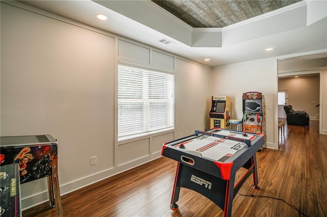 game room featuring wood-type flooring and ornamental molding