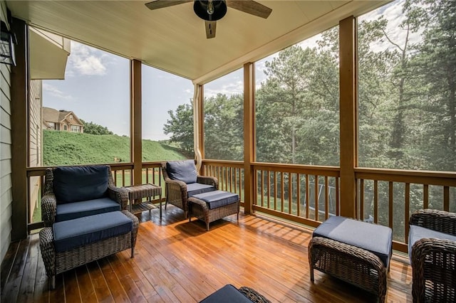 sunroom featuring ceiling fan