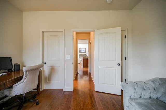 office space with dark hardwood / wood-style flooring