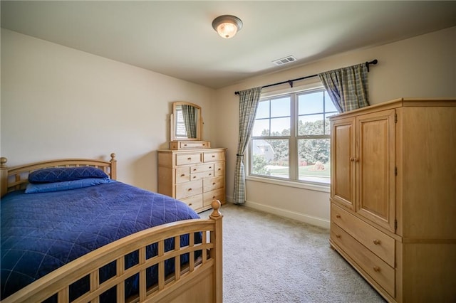 bedroom with light colored carpet