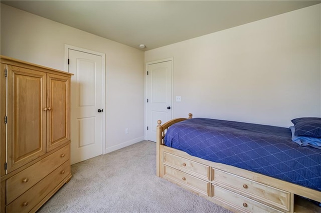 bedroom with light colored carpet