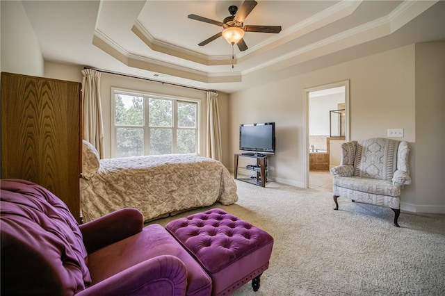 bedroom featuring ensuite bath, a raised ceiling, ceiling fan, and carpet floors