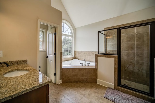 bathroom featuring vanity, tile patterned floors, separate shower and tub, and lofted ceiling