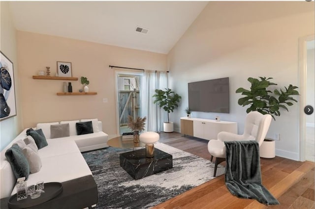 living room with high vaulted ceiling and dark hardwood / wood-style floors