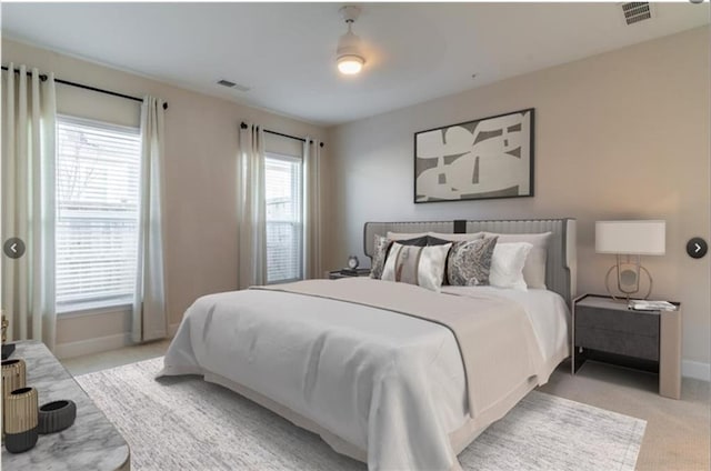 carpeted bedroom with ceiling fan