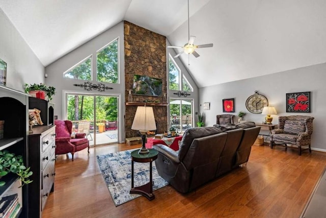 living room with ceiling fan, high vaulted ceiling, and hardwood / wood-style flooring