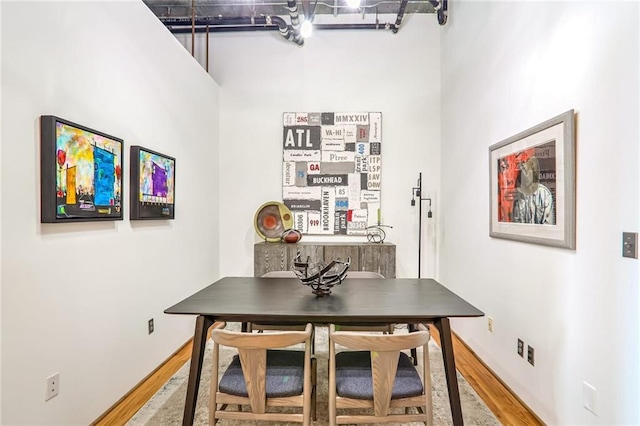 dining space with hardwood / wood-style floors