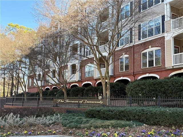 view of property featuring fence