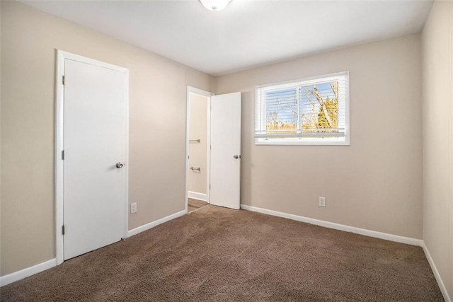 spare room featuring carpet floors