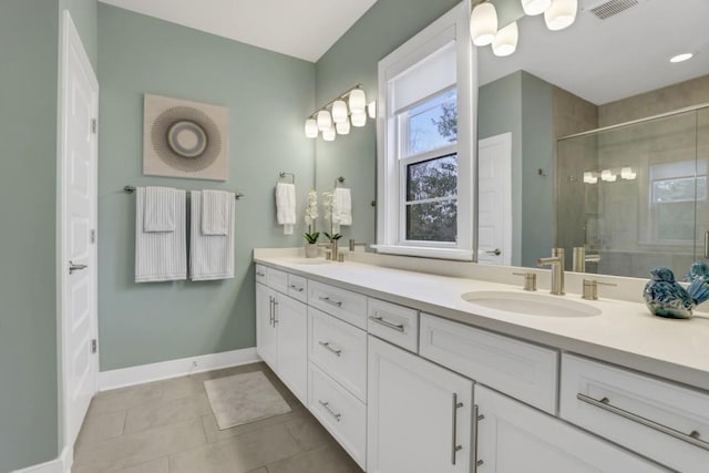 bathroom with walk in shower and vanity