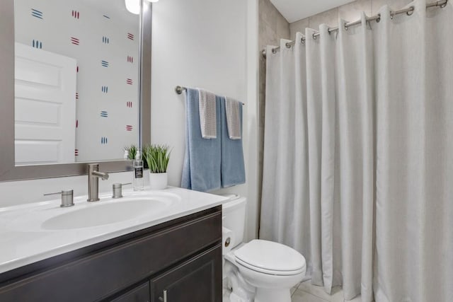 bathroom featuring walk in shower, vanity, and toilet